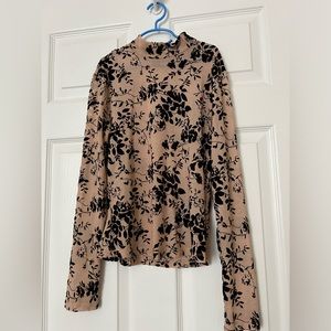 Small long sleeve embroidered top